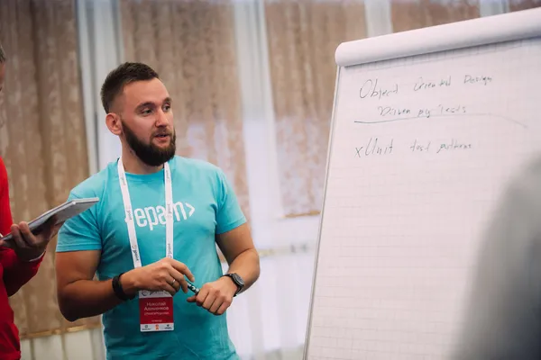 Mikalai at a flip chart during a workshop